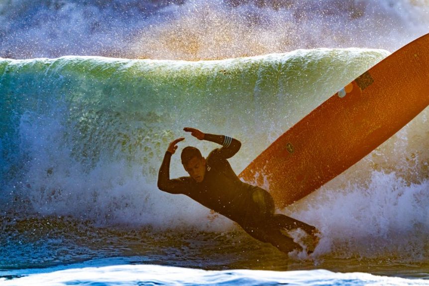 Man bailing from surfboard. Photo: Guy Kawasaki